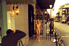 Woman in front of gate